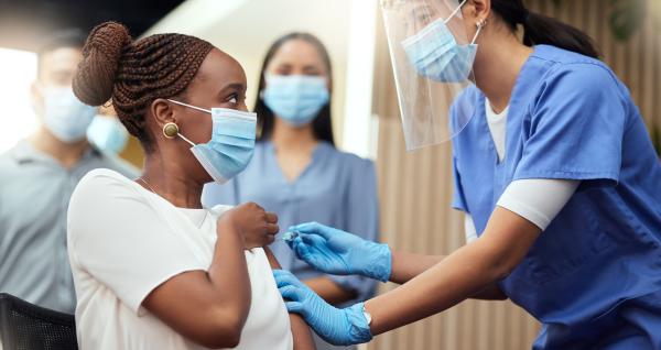 Woman gets covid vaccine